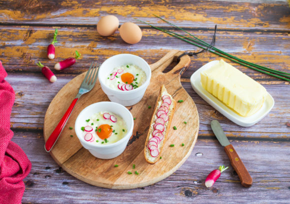 Baked eggs with goat’s cheese and radish soldiers