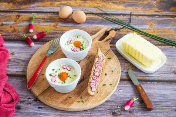 Baked eggs with goat’s cheese and radish soldiers